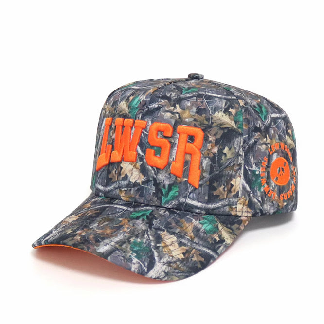 Woodlands L Hat side angle — camo snapback with orange LWSR embroidery and circle brand patch
